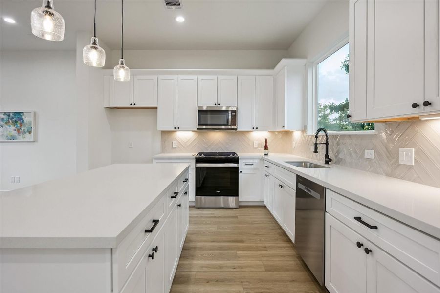 Soft-close cabinetry and drawers provide exceptional storage, while under-cabinet lighting adds both warmth and sophistication. Soft-close cabinetry and drawers provide exceptional storage, while under-cabinet lighting adds both warmth and sophistication.