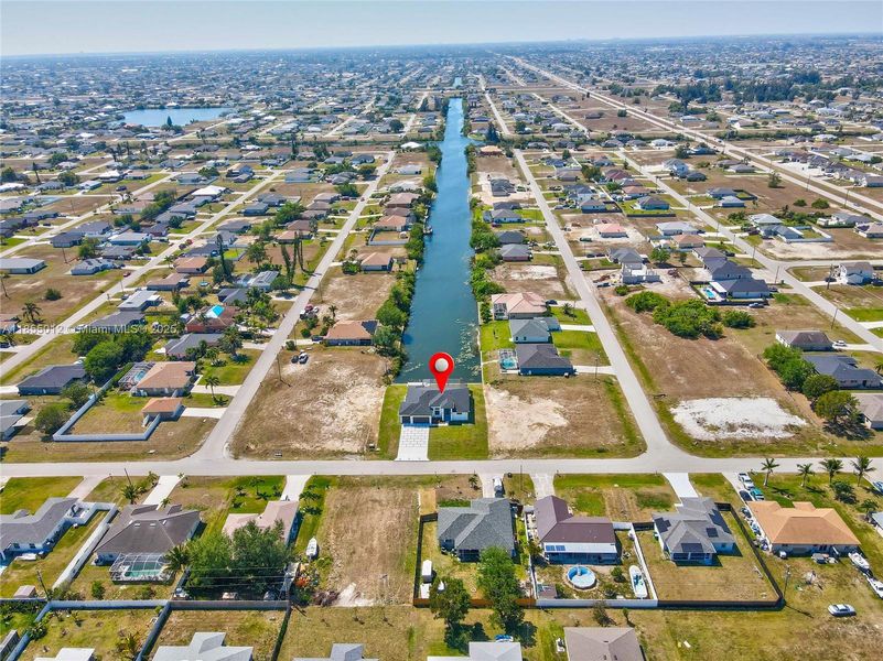 Aerial view with a water view and a residential view