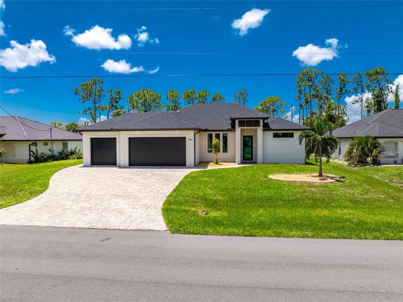 Front exterior of a new home in , Rotonda West, FL, highlighting curb appeal (Image 29).