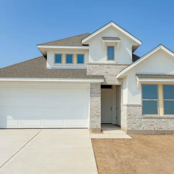 Front exterior of a new home in Escondido, Magnolia, TX, highlighting curb appeal (Image 1).