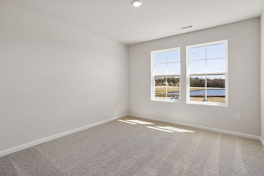 Spacious, unfurnished interior of a new home in Cambridge Reserve, Angier (Image 32).