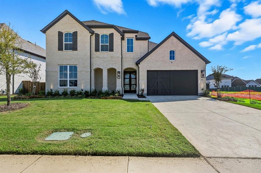 Front exterior of a new home in , Prosper, TX, highlighting curb appeal (Image 1). Front exterior of a new home in , Prosper, TX, highlighting curb appeal (Image 1).
