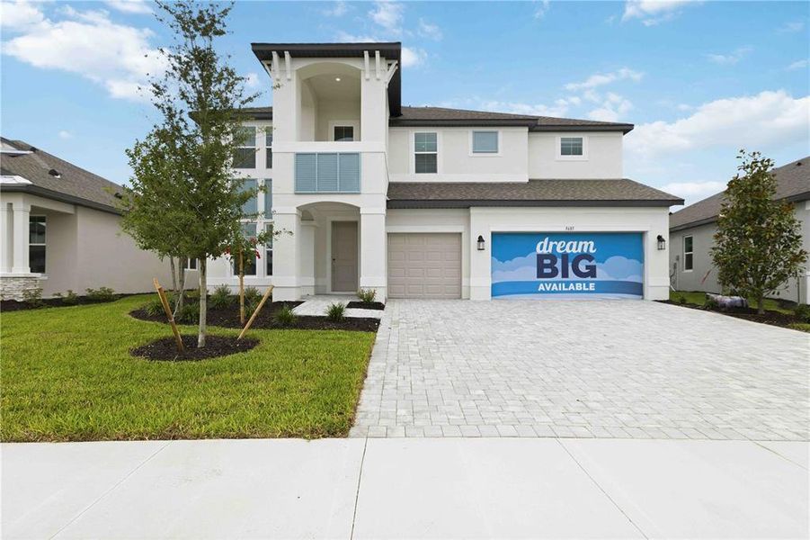 Front exterior of a new home in Creeks Edge at Twin Rivers, Parrish, FL, highlighting curb appeal (Image 1). Front exterior of a new home in Creeks Edge at Twin Rivers, Parrish, FL, highlighting curb appeal (Image 1).