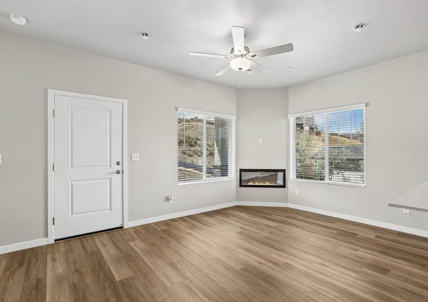 The family room is spacious with a ceiling fan.