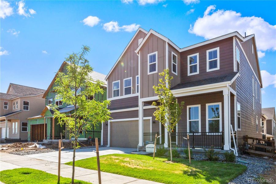 Front exterior of a new home in Dillon Pointe - Journey, Westminster, CO, highlighting curb appeal (Image 2).