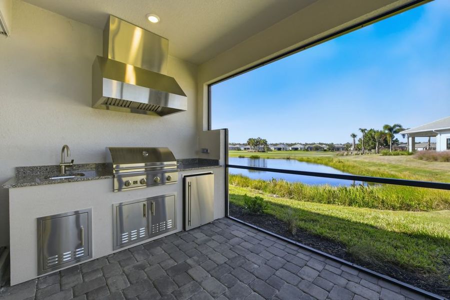 Exterior details and patio area of a home in Esplanade at Azario Lakewood Ranch, Bradenton (Image 2). Exterior details and patio area of a home in Esplanade at Azario Lakewood Ranch, Bradenton (Image 2).