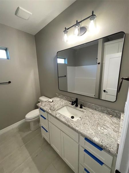 Bathroom with vanity and toilet