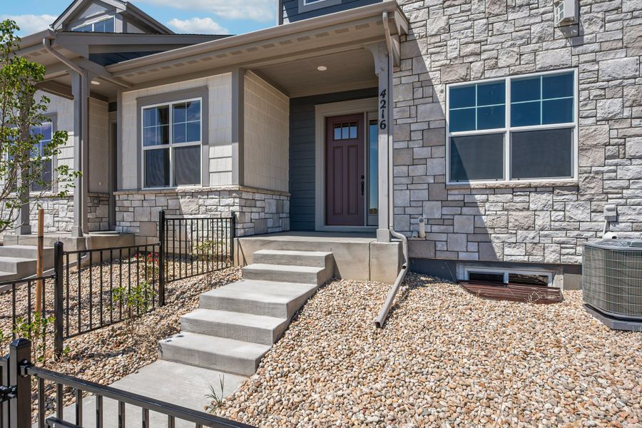 Exterior details and patio area of a home in The Lakes at Centerra, Loveland (Image 2).