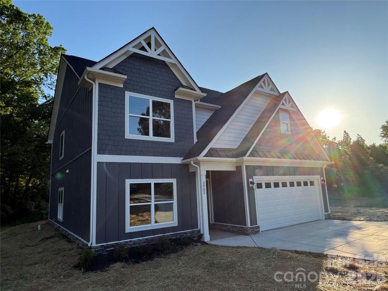 Front exterior of a new home in , Monroe, NC, highlighting curb appeal (Image 18).