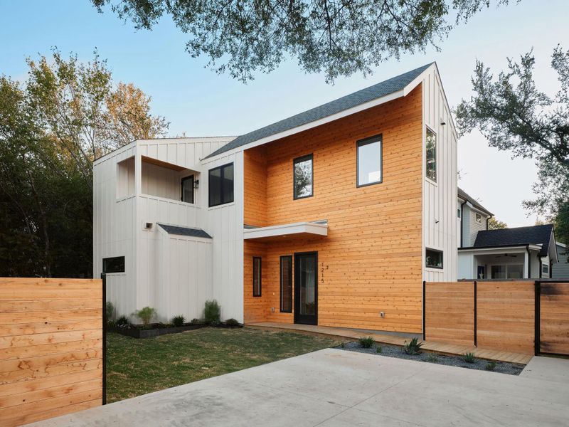 Back of property featuring board and batten siding, a balcony, and a shingled roof Back of property featuring board and batten siding, a balcony, and a shingled roof