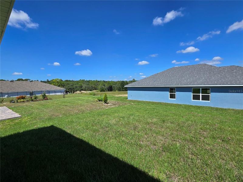 Exterior details and patio area of a home in Twisted Oaks, Beverly Hills (Image 3).