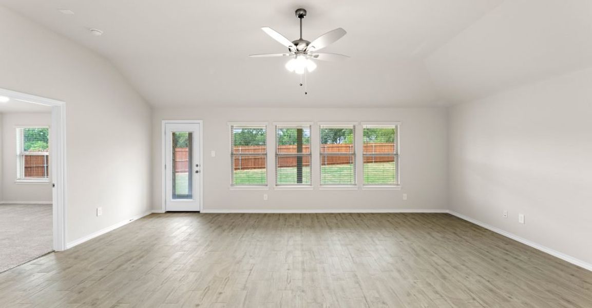 Representative exterior photo of a completed home built from the Austin by Impression Homes in Keeneland, Aubrey, TX (Image 11).