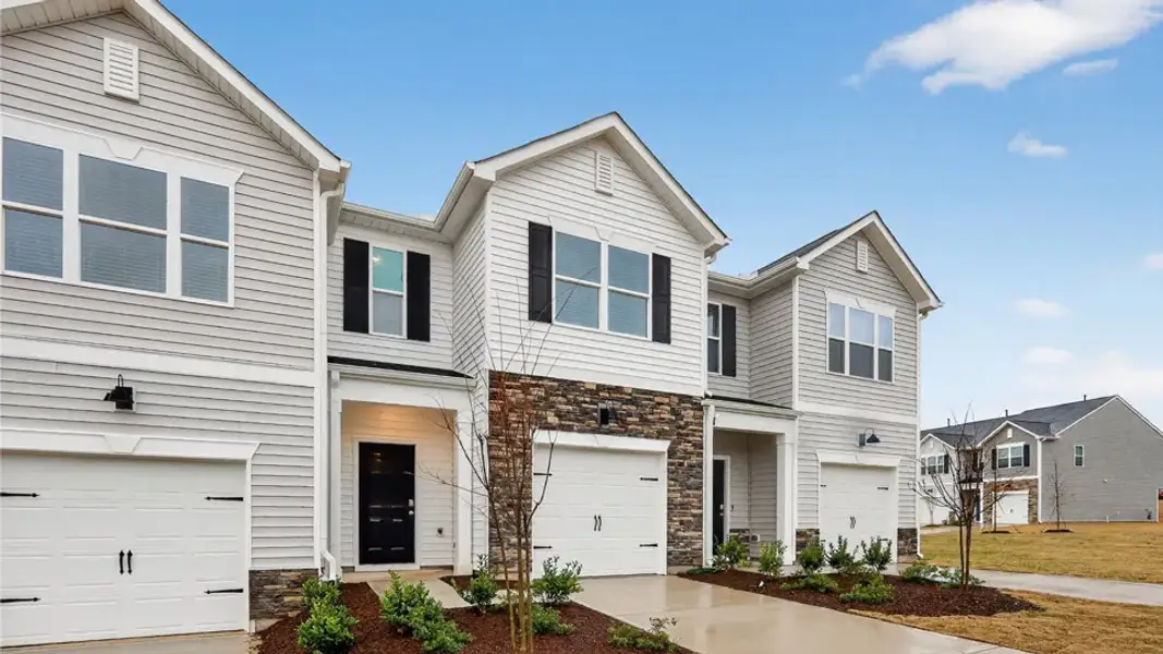 Front exterior of a new home in The Townes at Galvins Ridge, Sanford, NC, highlighting curb appeal (Image 16).