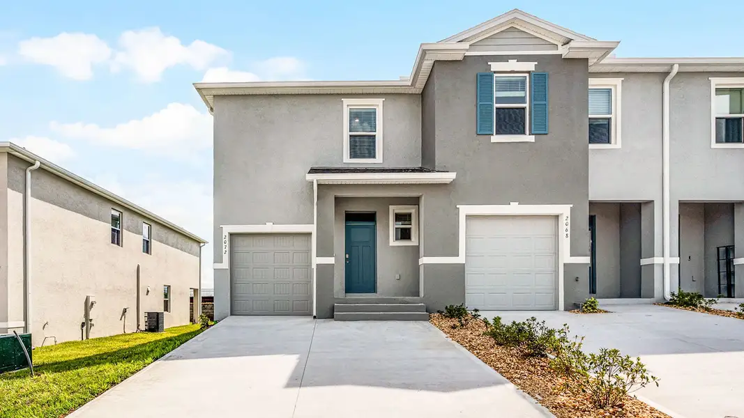 Front exterior of a new home in Brentwood, Davenport, FL, highlighting curb appeal (Image 1). Front exterior of a new home in Brentwood, Davenport, FL, highlighting curb appeal (Image 1).
