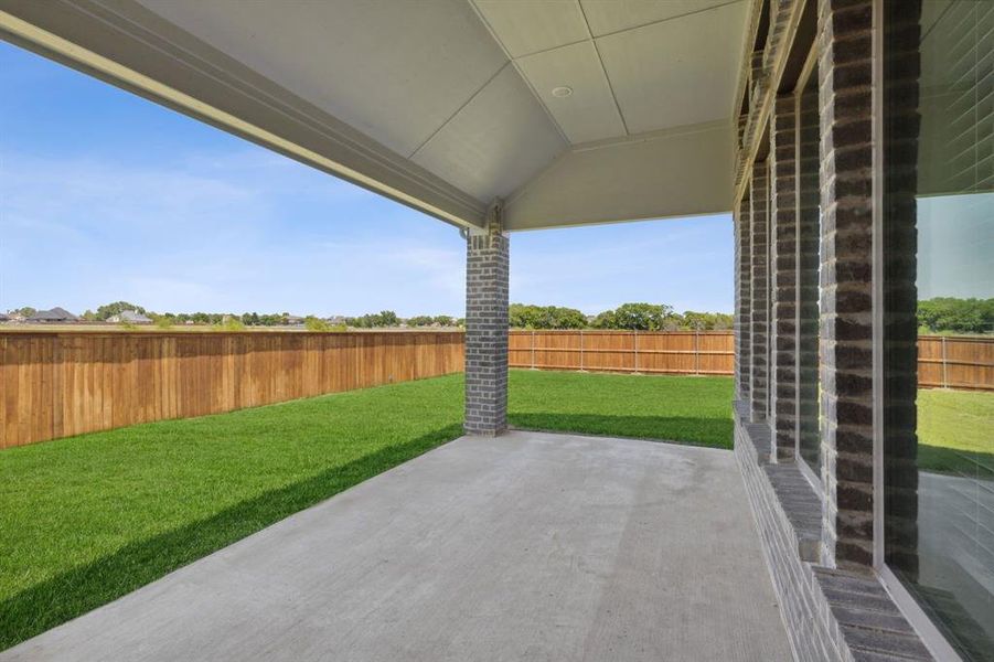 Covered Patio in the Henley home plan by Trophy Signature Homes – REPRESENTATIVE PHOTO Covered Patio in the Henley home plan by Trophy Signature Homes – REPRESENTATIVE PHOTO