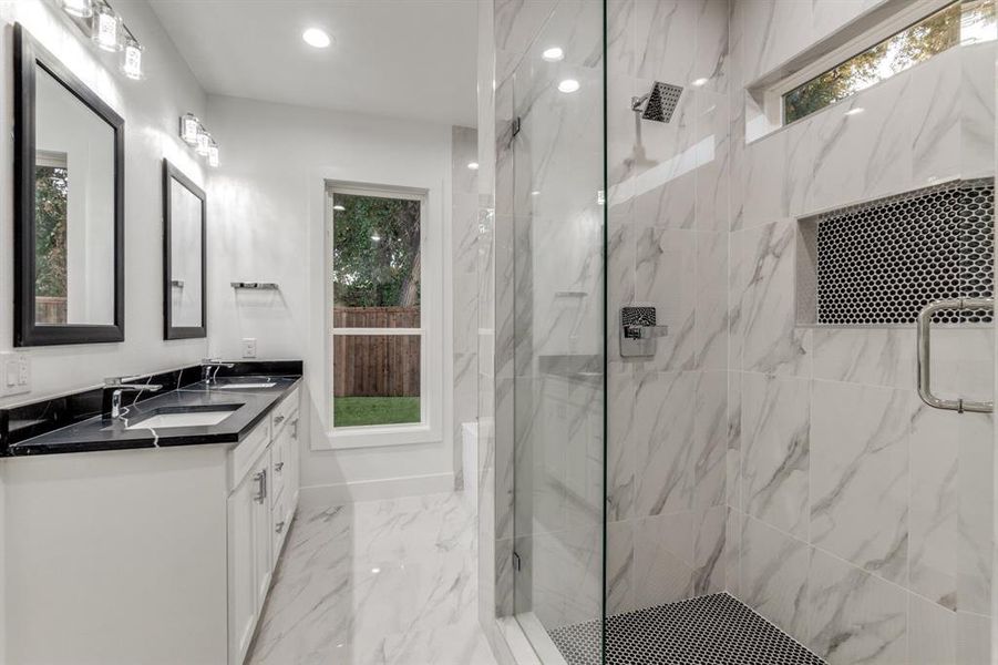 Bathroom with vanity and an enclosed shower