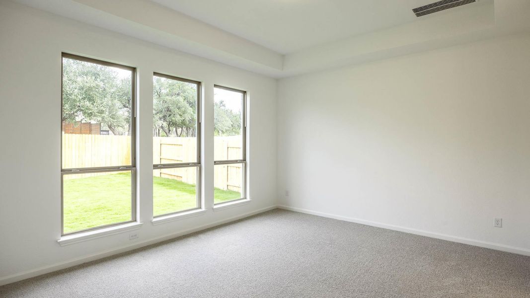 Unfurnished room featuring carpet flooring and baseboards Unfurnished room featuring carpet flooring and baseboards