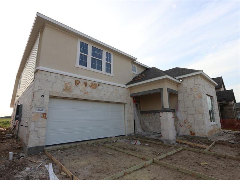 Front exterior of a new home in Marvida, Cypress, TX, highlighting curb appeal (Image 15).
