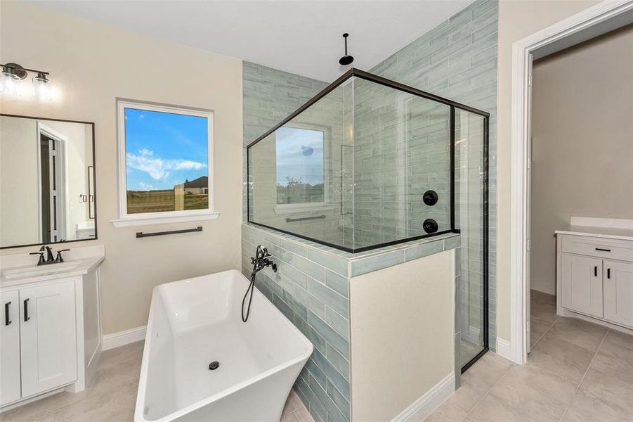 Bathroom with separate shower and tub, tile patterned flooring, and vanity