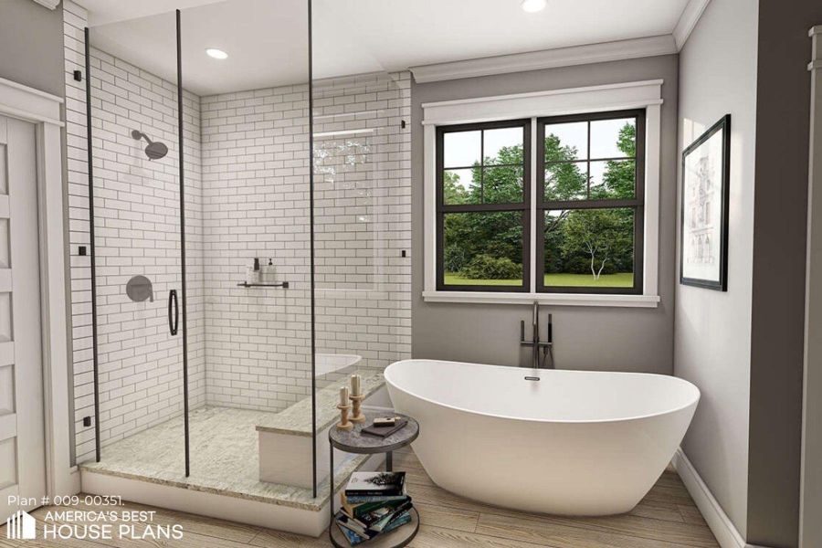 Full bathroom featuring a shower stall, a freestanding tub, and recessed lighting