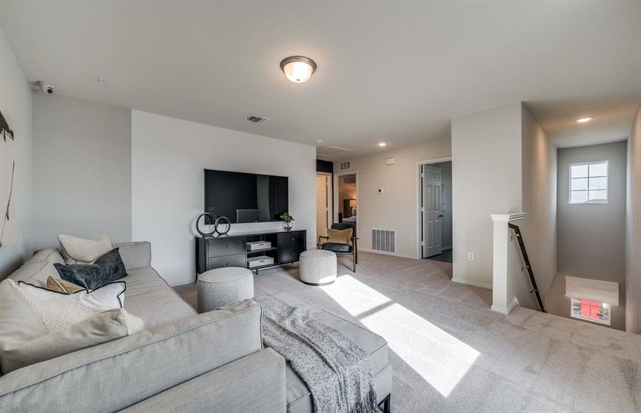 Expansive gathering room bathed in natural sunlight *Model representation