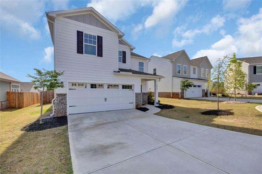 Front exterior of a new home in , Covington, GA, highlighting curb appeal (Image 22).