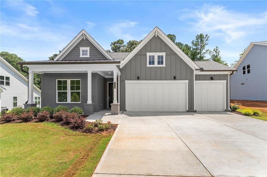 Front exterior of a new home in Hillgrove Preserve, Powder Springs, GA, highlighting curb appeal (Image 27).