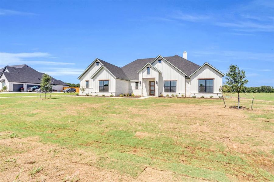Front exterior of a new home in , Waxahachie, TX, highlighting curb appeal (Image 18).