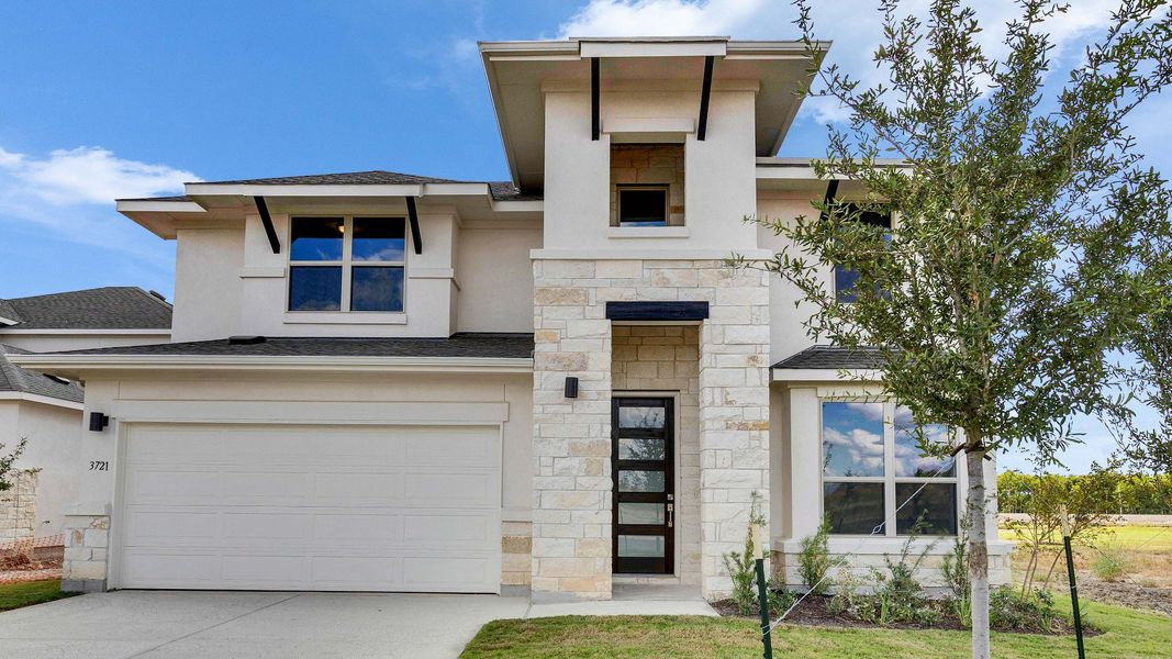 Representative exterior photo of a completed home built from the Rosewood by DRB Homes in Preserve at Lakeside Meadows, Pflugerville, TX (Image 21). Representative exterior photo of a completed home built from the Rosewood by DRB Homes in Preserve at Lakeside Meadows, Pflugerville, TX (Image 21).