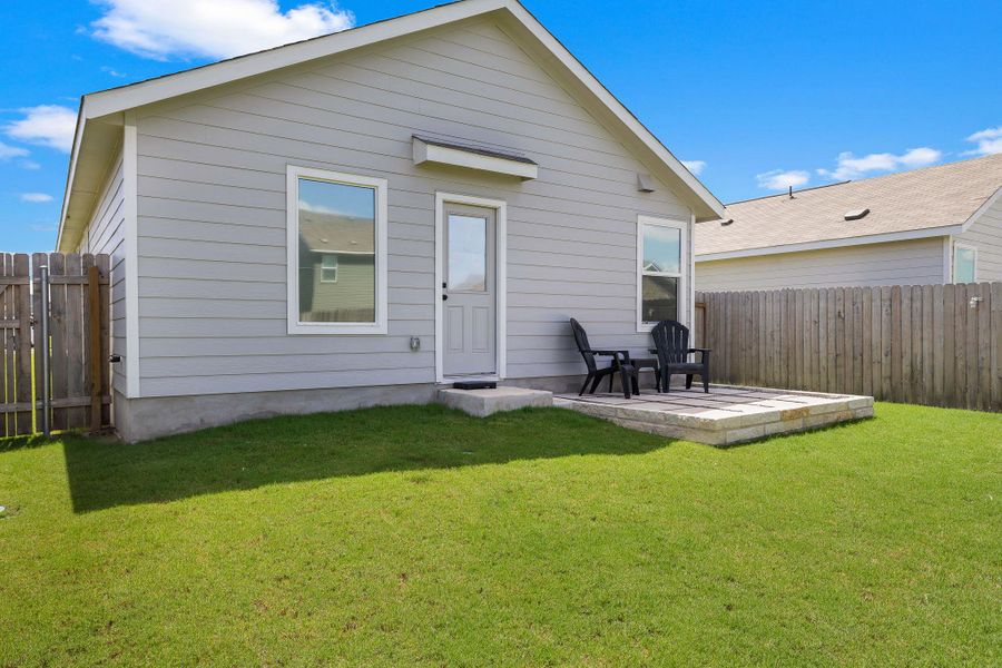 A neatly manicured lawn extends to a private fenced yard, designed for outdoor enjoyment. A neatly manicured lawn extends to a private fenced yard, designed for outdoor enjoyment.