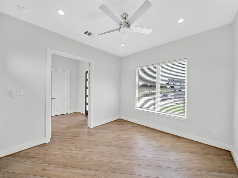 Unfurnished room featuring light hardwood / wood-style flooring and ceiling fan