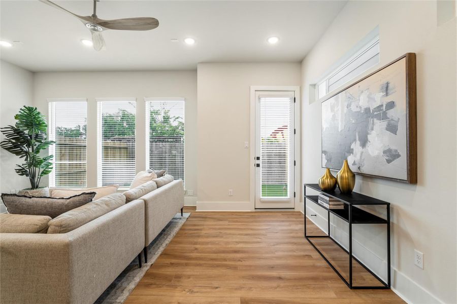 A living space designed to feel bright and effortless, where large picture windows bring in natural light and create a seamless connection to the backyard. A living space designed to feel bright and effortless, where large picture windows bring in natural light and create a seamless connection to the backyard.