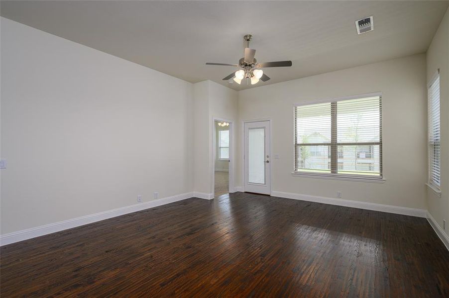 Family room featuring hand scraped flooring and ceiling fan