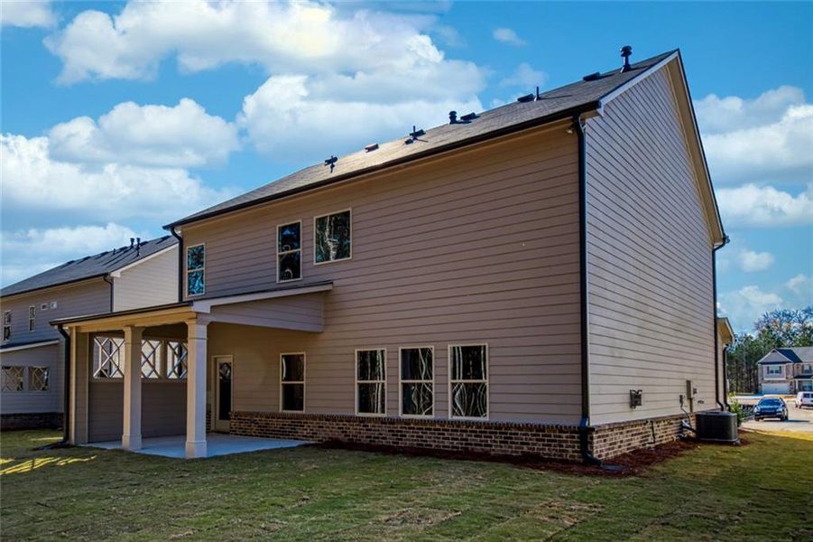Exterior details and patio area of a home in Enclave at Logan Point, Loganville (Image 18).