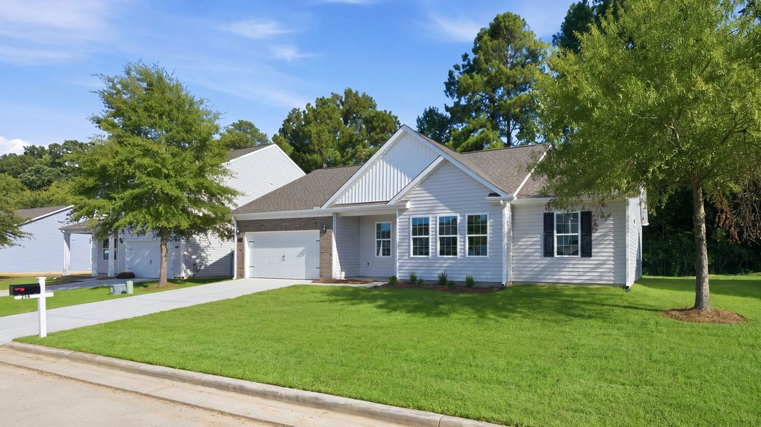 Front exterior of a new home in Tyler - Home on the Lake, New Bern, NC, highlighting curb appeal (Image 18).