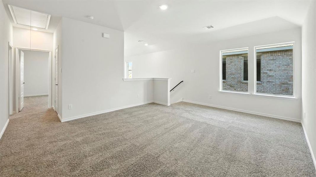 Spare room featuring attic access, light colored carpet, and recessed lighting Spare room featuring attic access, light colored carpet, and recessed lighting