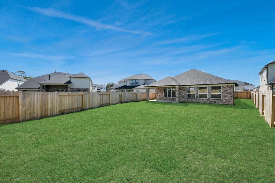 Backyard retreat, offering an abundance of space for kids to play and explore. The possibilities are endless in this outdoor haven, where the joy of open-air activities and family gatherings awaits.