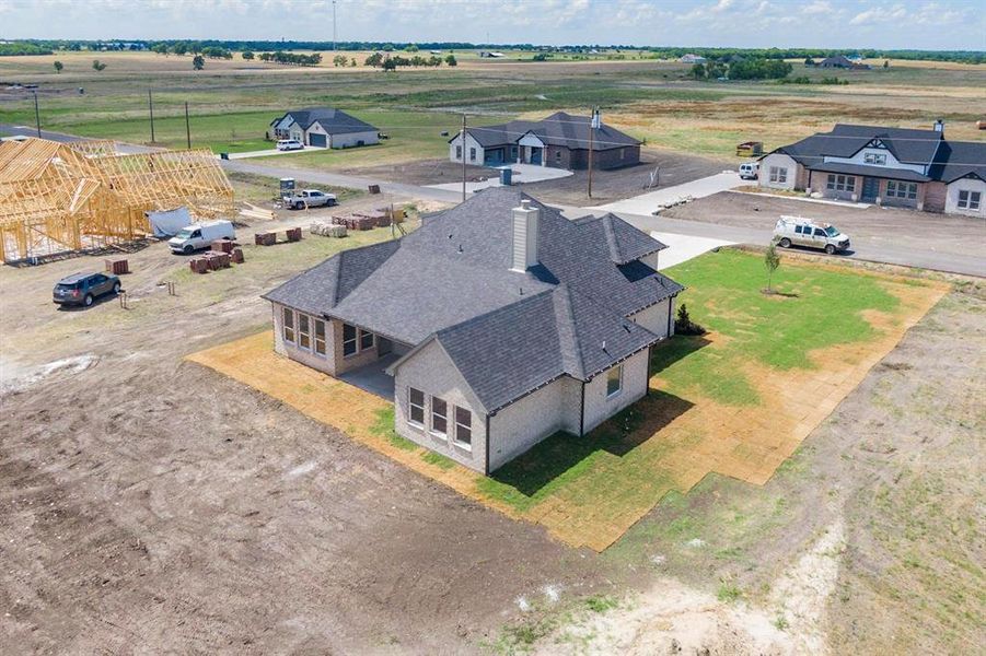 Birds eye view of property featuring a rural view