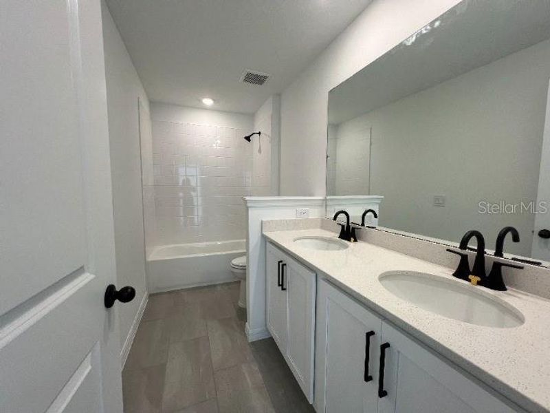 Furnished interior view inside a new home in Hawks Run, Kissimmee (Image 7). Furnished interior view inside a new home in Hawks Run, Kissimmee (Image 7).