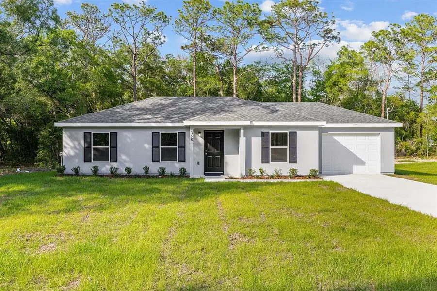 Front exterior of a new home in , Ocala, FL, highlighting curb appeal (Image 2).