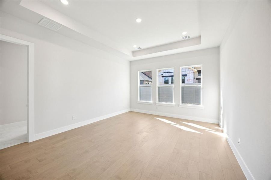 Located at the rear of the home for added privacy, this spacious owner's suite was designed for rest and relaxation.