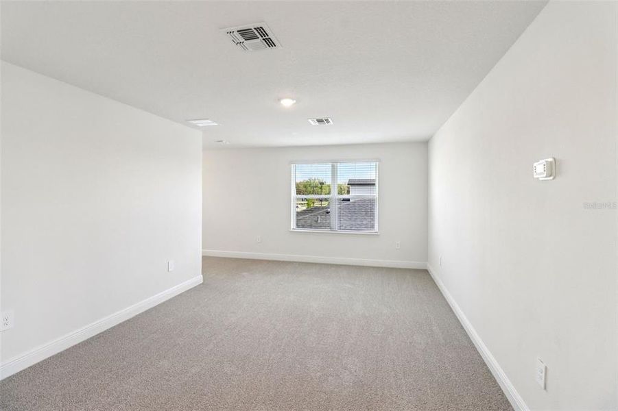Spacious, unfurnished interior of a new home in The Reserve at Hammock Oaks - Classic Series, Lady Lake (Image 19).