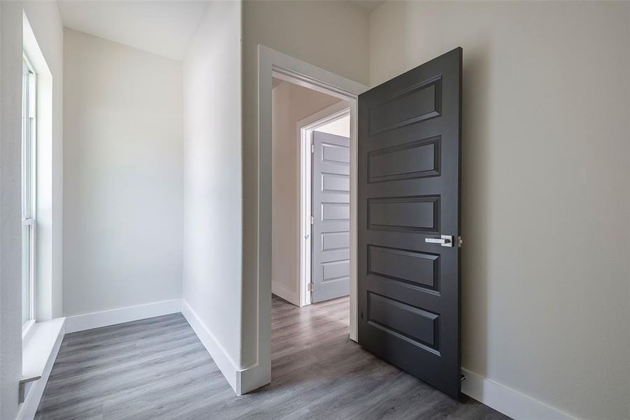 Hallway featuring hardwood / wood-style floors