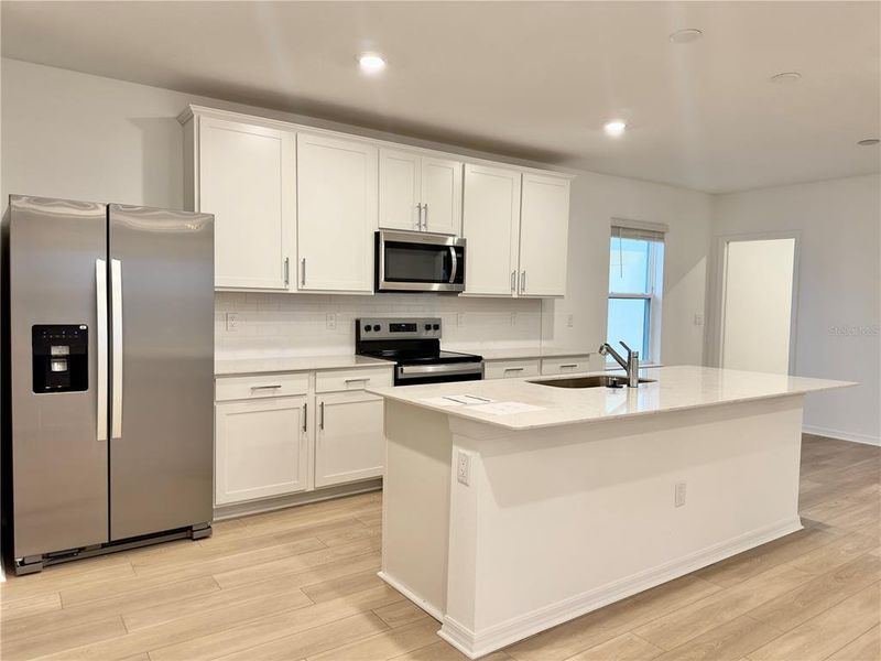 Furnished interior view inside a new home in Parkside Trails, Clermont (Image 7).