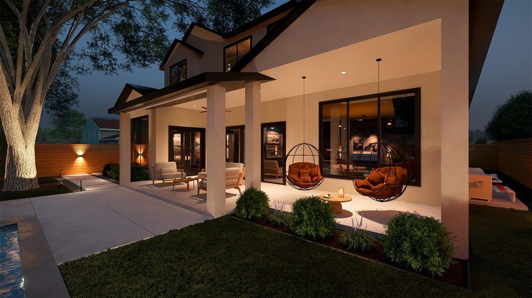Illuminated patio provides an inviting ambiance for evening enjoyment, surrounded by meticulous landscaping and a privacy fence.