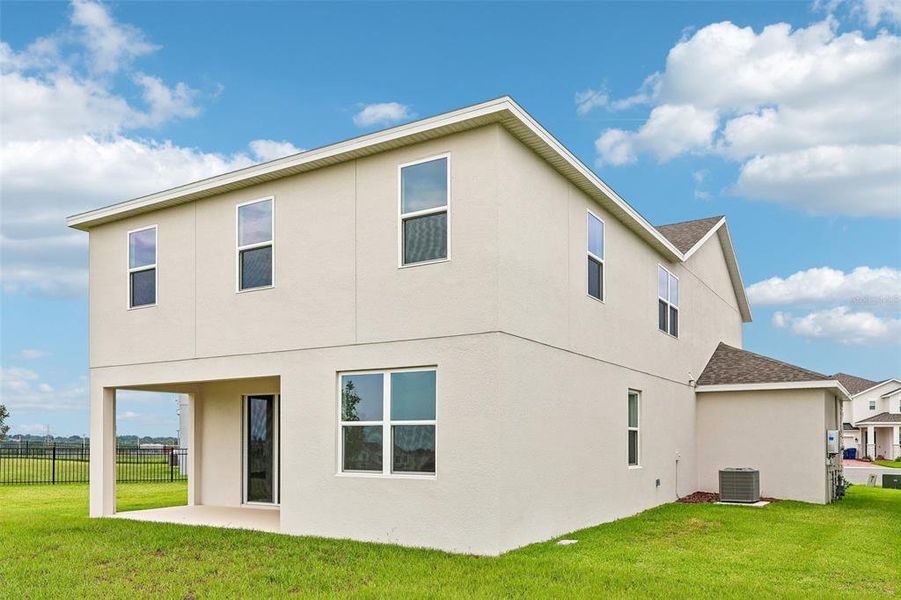 Exterior details and patio area of a home in Park View at the Hills, Minneola (Image 20).