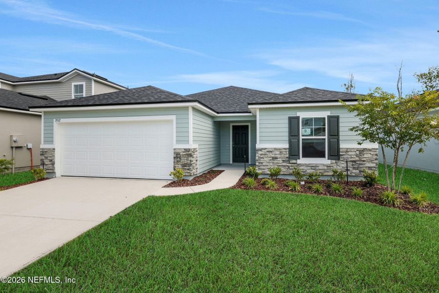 Front exterior of a new home in Wilford Oaks, Orange Park, FL, highlighting curb appeal (Image 1). Front exterior of a new home in Wilford Oaks, Orange Park, FL, highlighting curb appeal (Image 1).