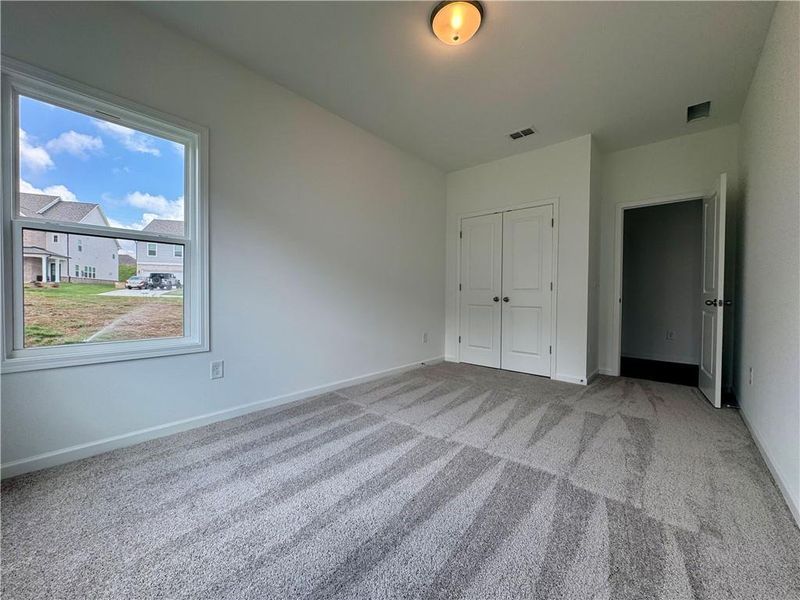 Spacious, unfurnished interior of a new home in Eastlyn Crossing - Single Family, Flowery Branch (Image 38). Spacious, unfurnished interior of a new home in Eastlyn Crossing - Single Family, Flowery Branch (Image 38).