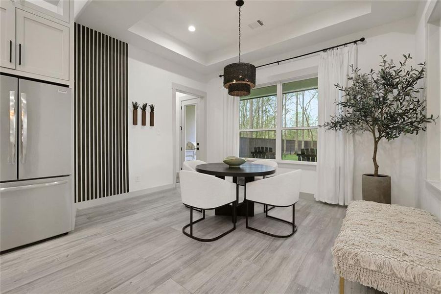 Love the accent wall to the right of the refrigerator. That entry leads to bedroom/bath area for guests.