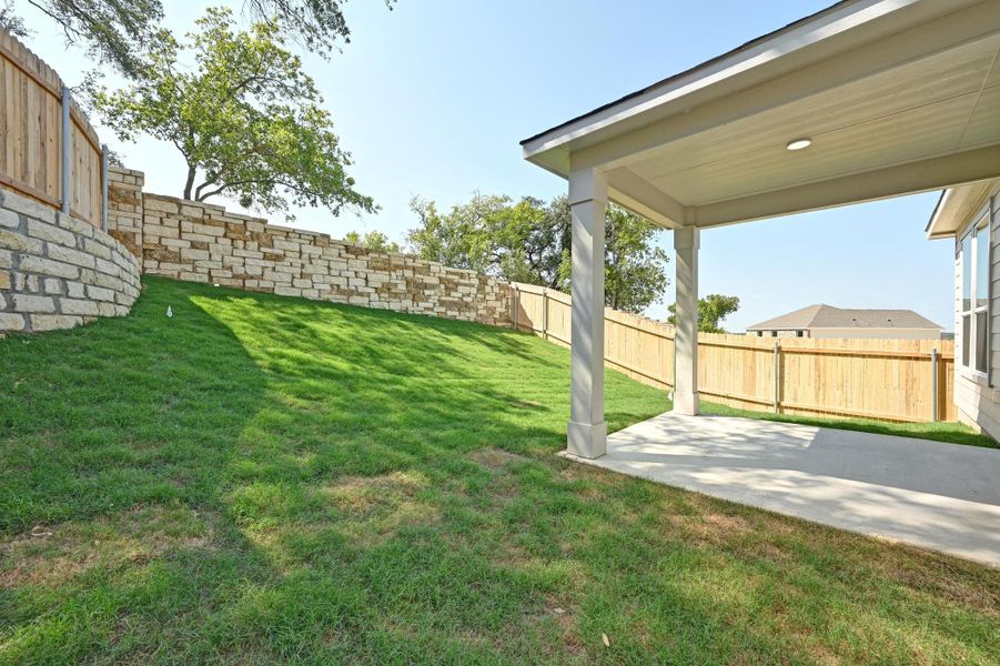 Front exterior of a new home in Creekside at Estancia, Austin, TX, highlighting curb appeal (Image 21).